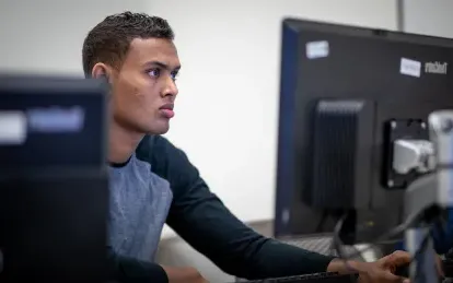 male student on a computer 