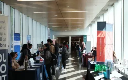 students talking with employers at a career fair